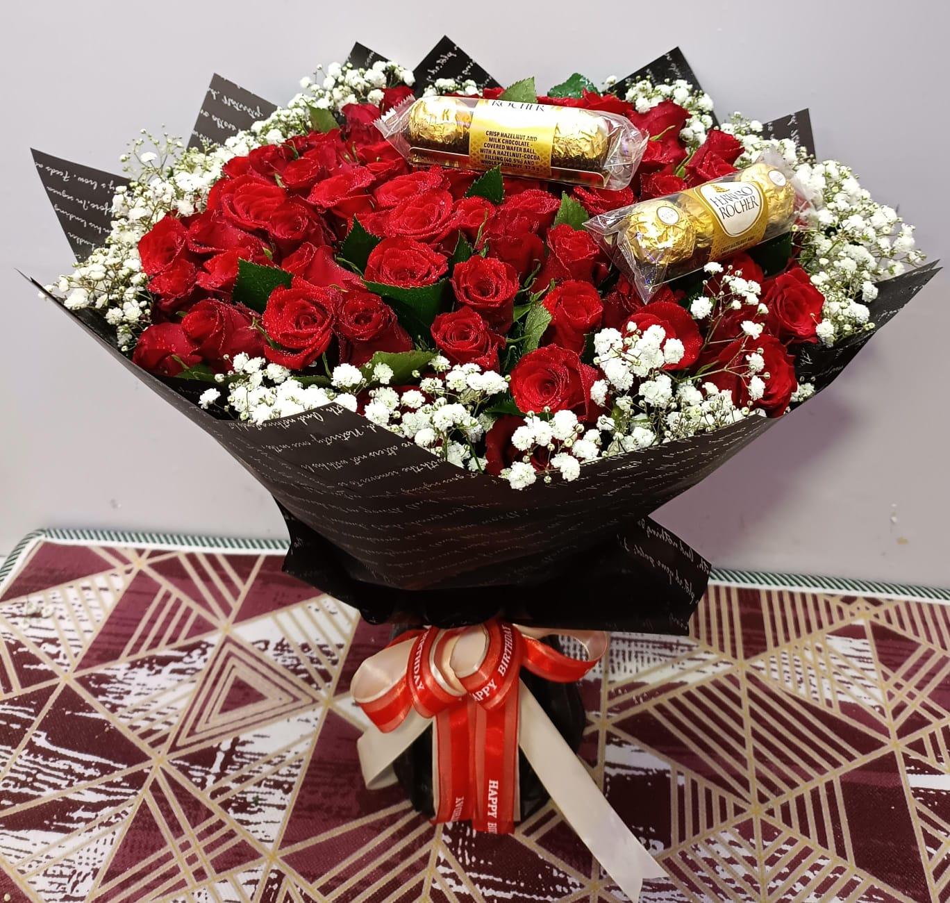 Bouquet of red roses and ferrero chocolates