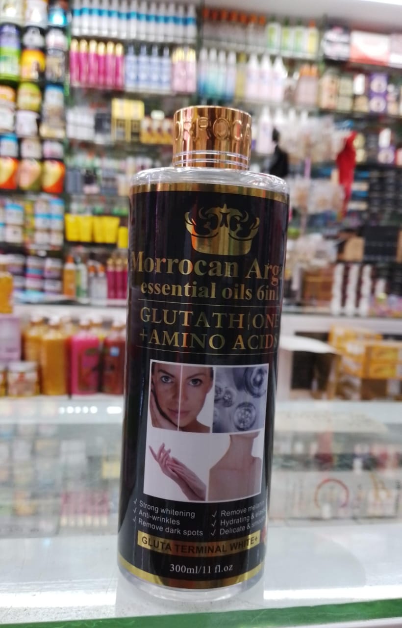 Bottle of Moroccan Argan oil with product details on a store shelf background