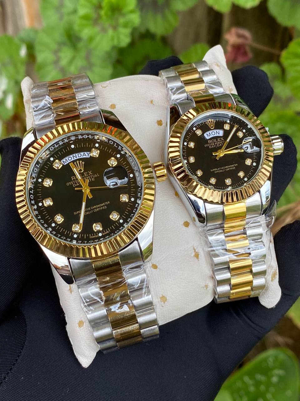 ROLEX COUPLE WATCHES SINGLE PIECE DAY AND DATE DISPLAY WATER RESISTANT BATTERY POWERED ENQUIRIES