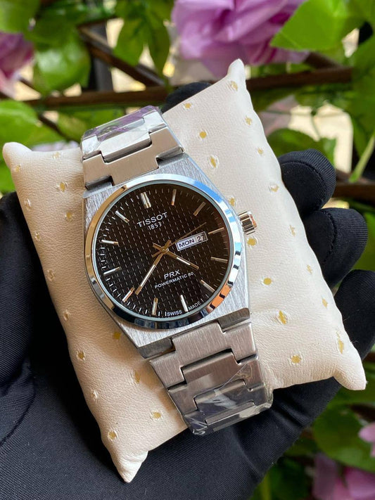 TISSOT DAY & DATE BATTERY POWERED WATER RESISTANT DAY & DATE DISPLAY STAINLESS STEEL FINISH ENQUIRIES