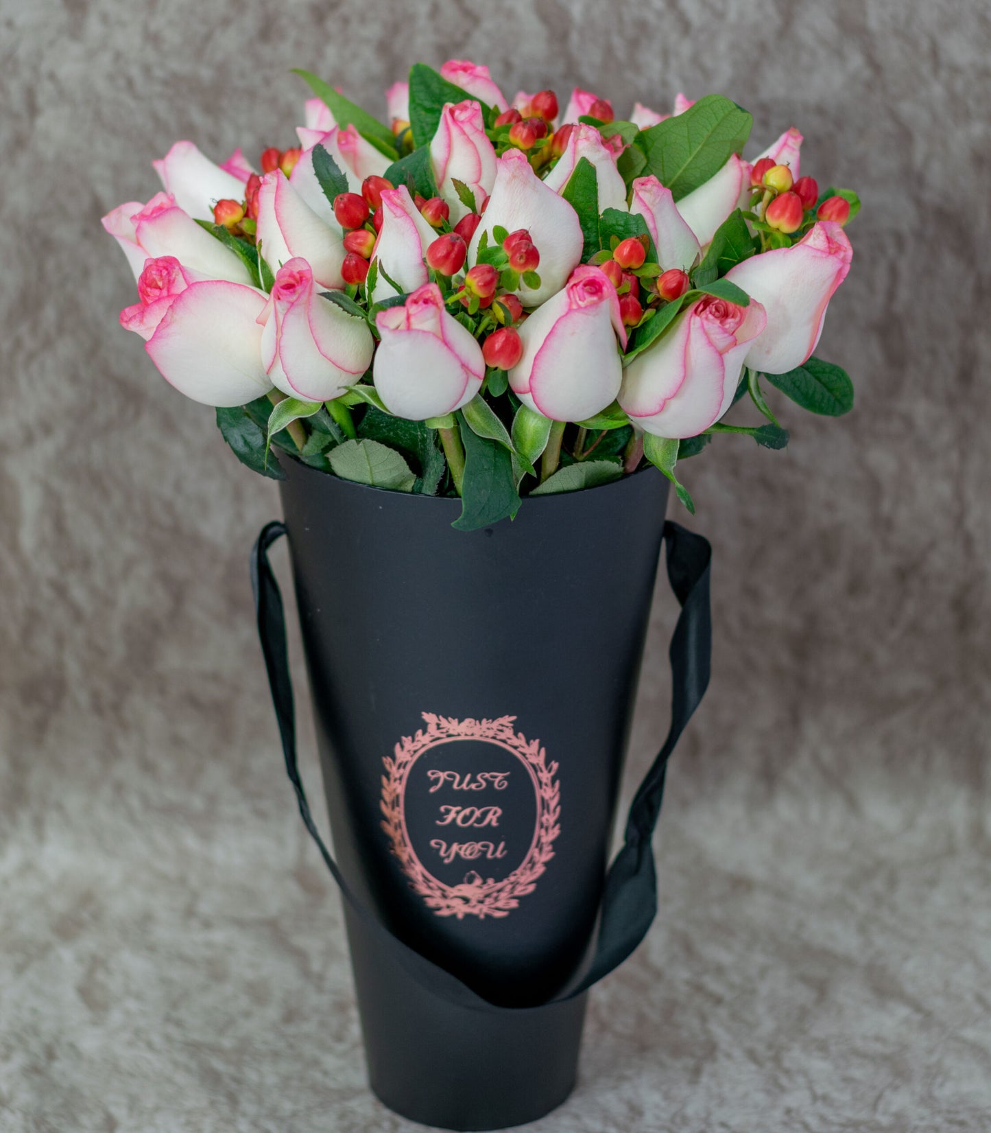 Pink Roses and Mixed Berry Flowers in a Black Vase.