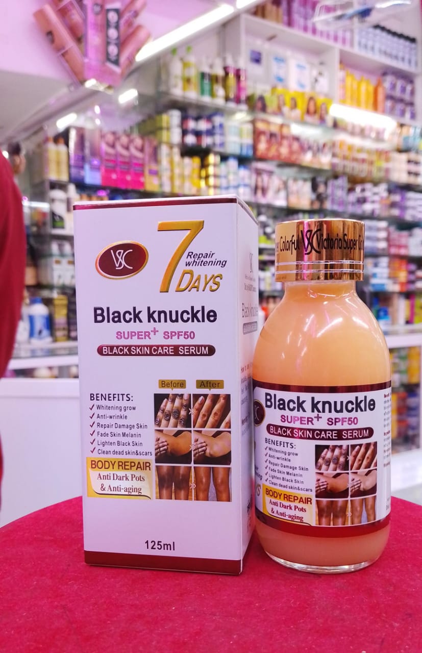 Black knuckle serum packaging with a box on a store shelf background