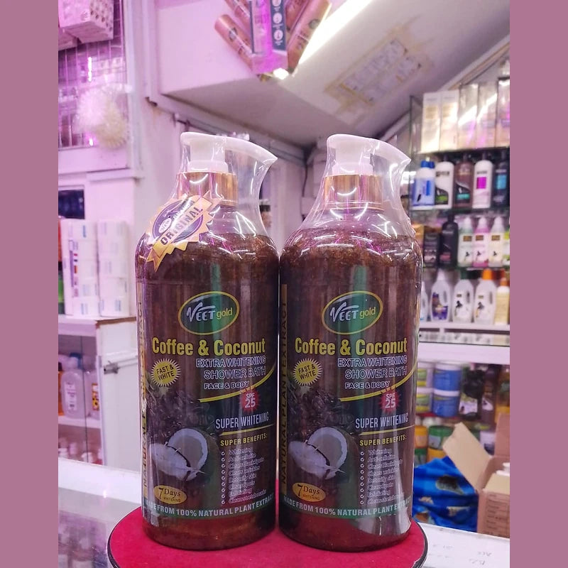 Two bottles of 'Coffee & Coconut' product on a red stand with a store shelf in the background.
