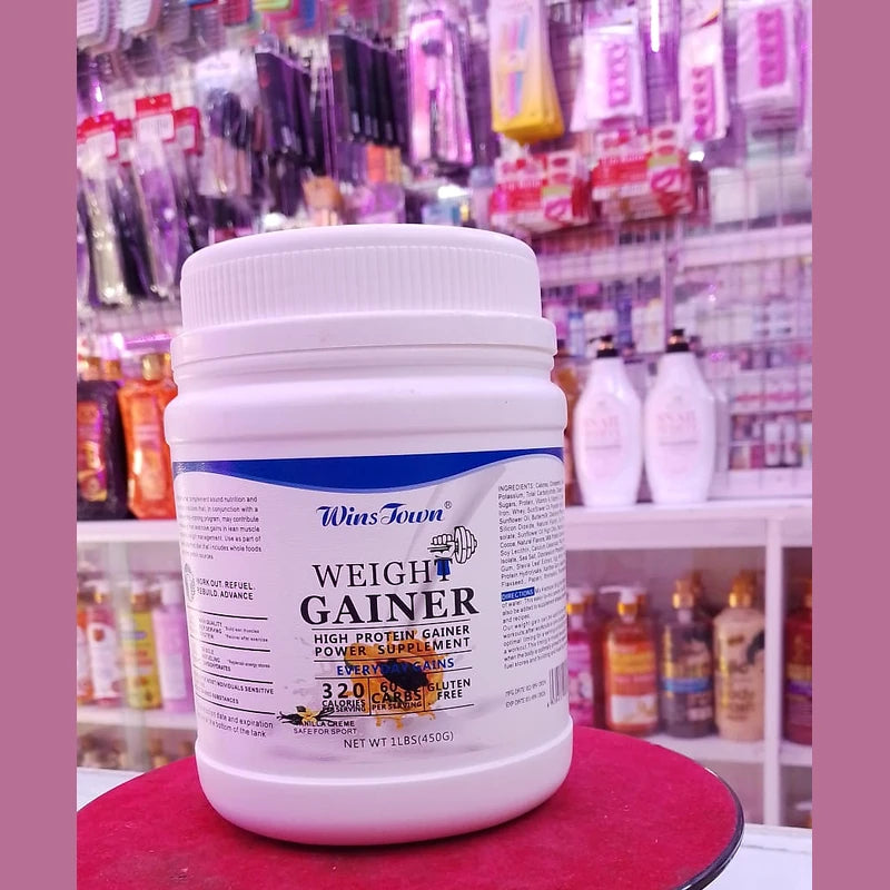 Weight gainer supplement container on a red surface with a store shelf in the background