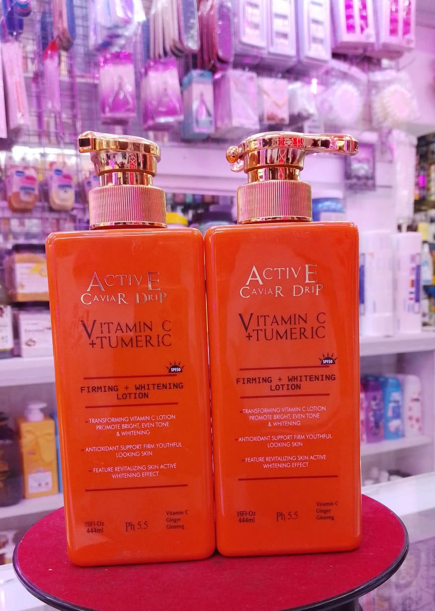 Two bottles of Active Caviar Lotion on a round surface with a store shelf in the background.