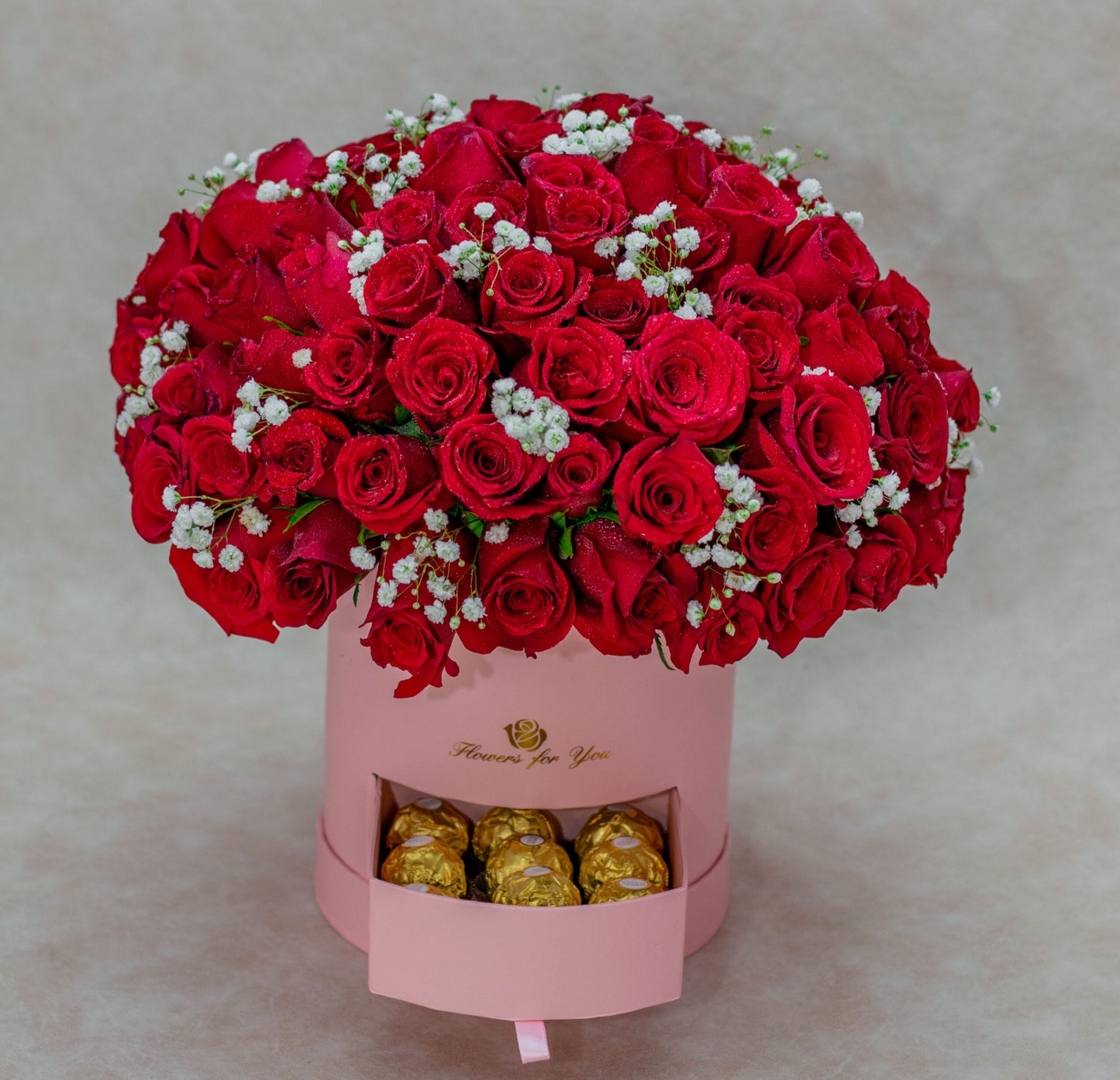 Arrangement with Red Roses and Gerberas in a Pink Flower Box