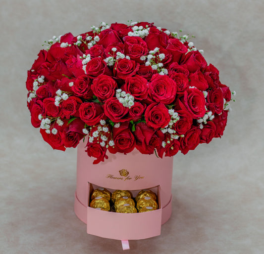 Arrangement with Red Roses and Gerberas in a Pink Flower Box