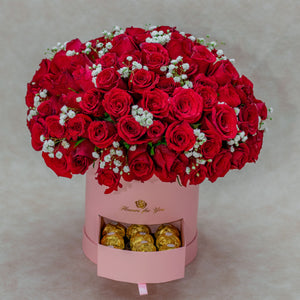 Arrangement with Red Roses and Gerberas in a Pink Flower Box
