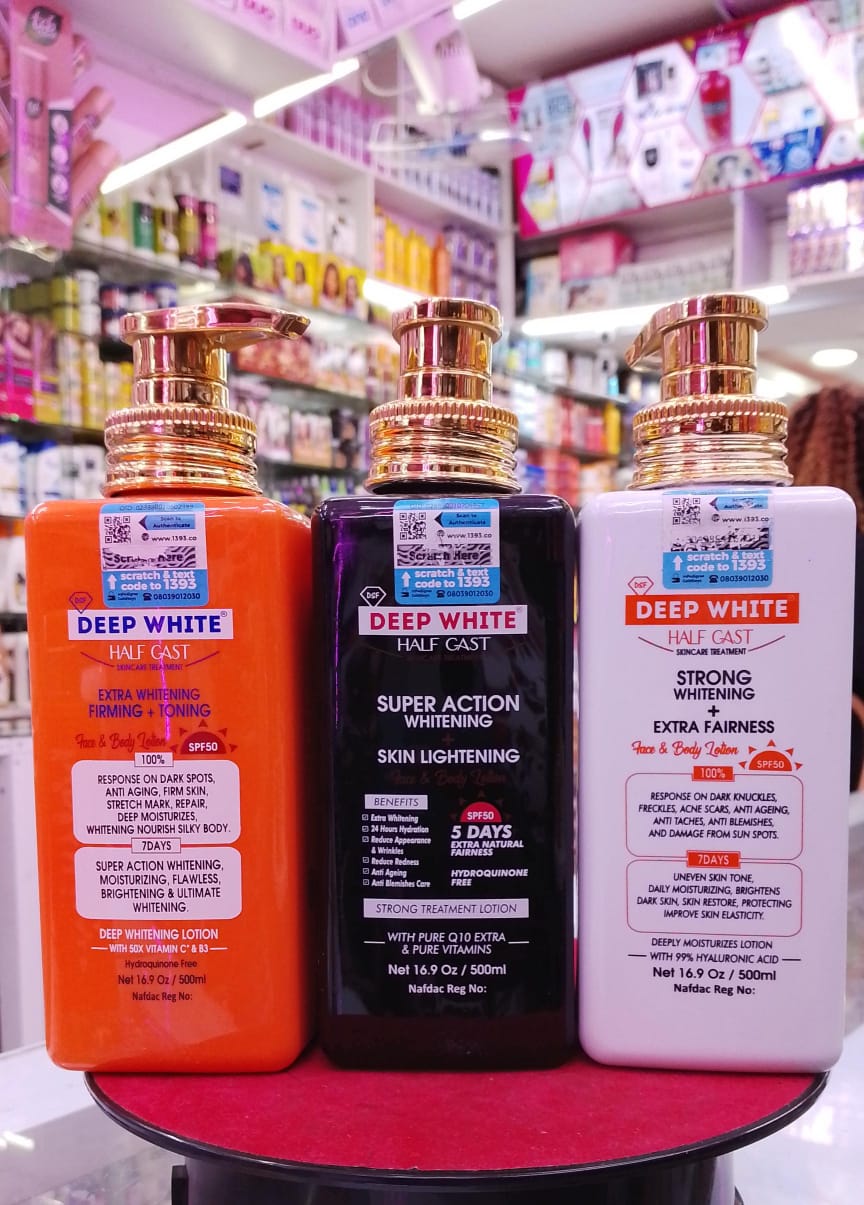 Three bottles of Deep White products on a shelf in a store.