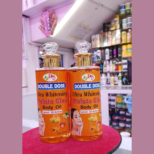 Two bottles of Double Dose Ultra Whitening Melato Glow Body Oil on a red surface with a store shelf in the background.