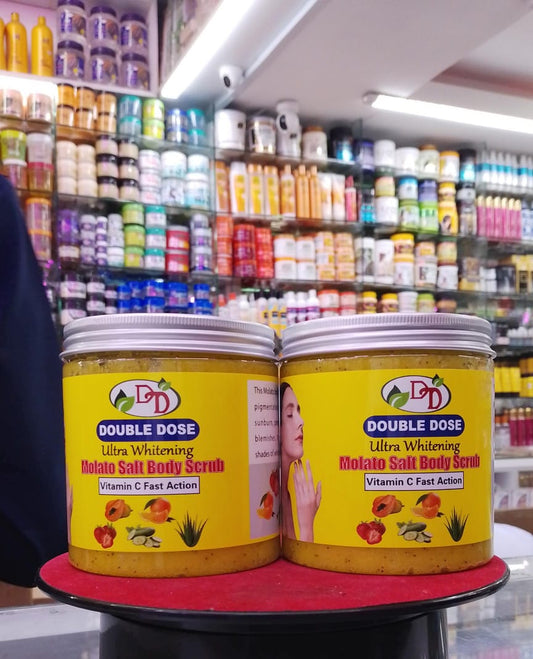 Two jars of Double Dose Ultra Whitening Potato Salt Body Scrub on a red stand with a store shelf in the background.