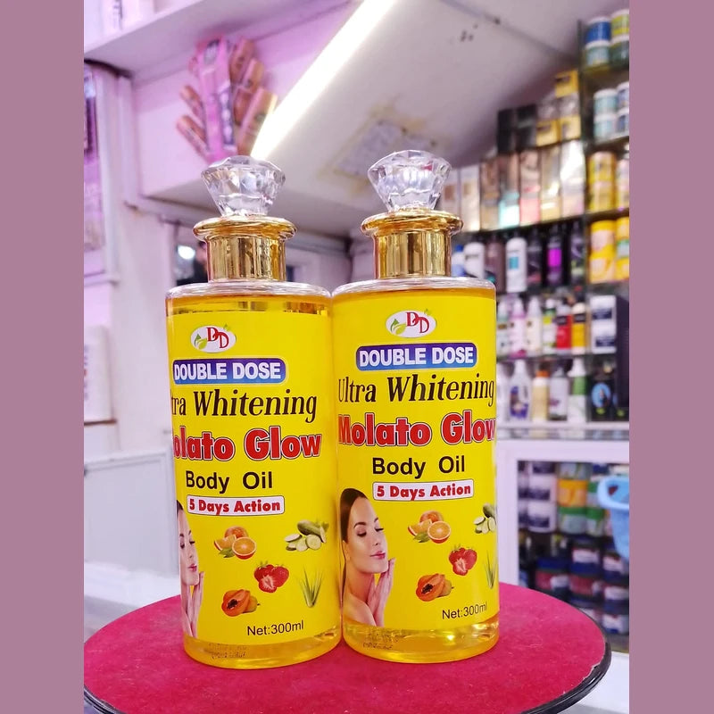 Two bottles of Double Dose Ultra Whitening Body Oil on a red surface with a store shelf in the background.