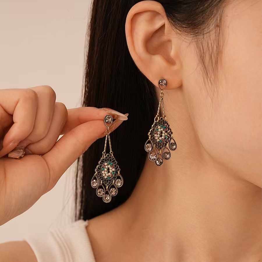 Vintage high-end silver needle ethnic style diamond inlaid flower earrings with exaggerated European and American temperament earrings pendant light luxury niche earrings