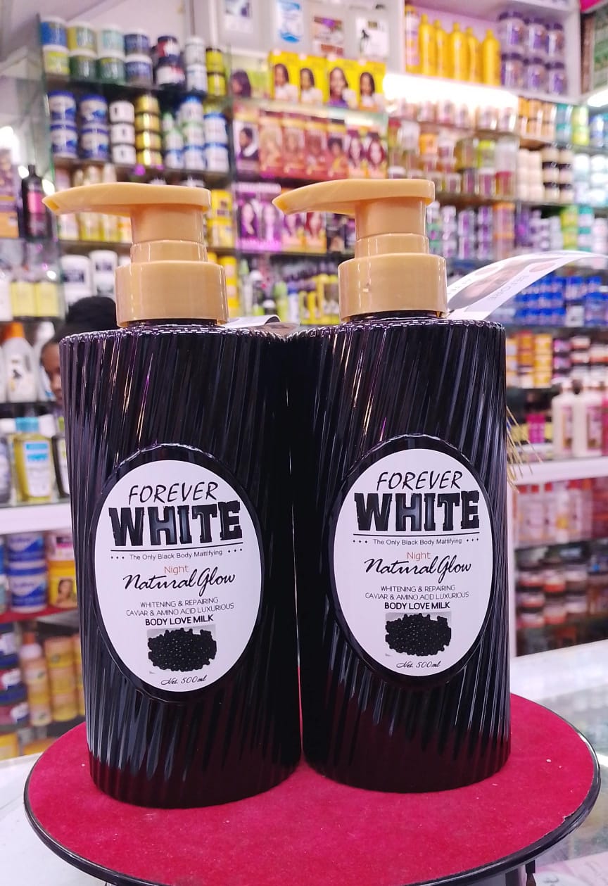 Two bottles of 'Forever White' product on a red surface with a store shelf in the background.