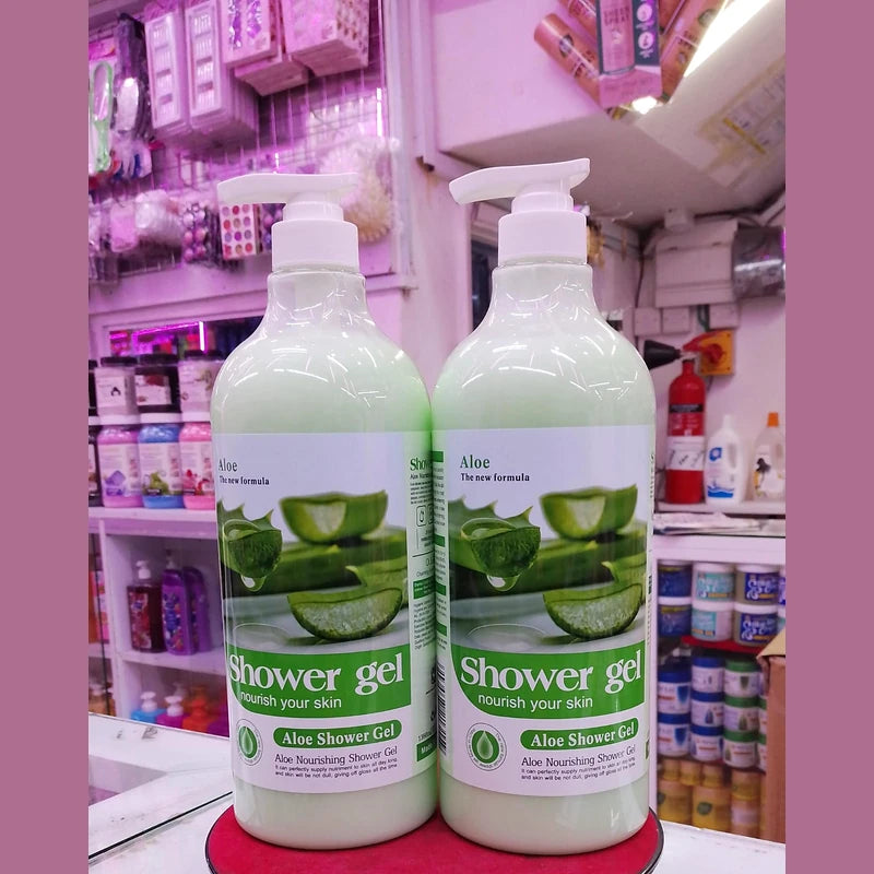 Two bottles of aloe vera shower gel on a shelf in a store.
