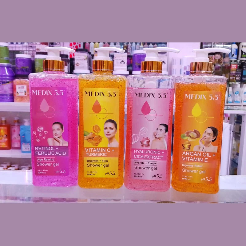 Four bottles of Medix 5.5 shower gel on a shelf with colorful packaging.