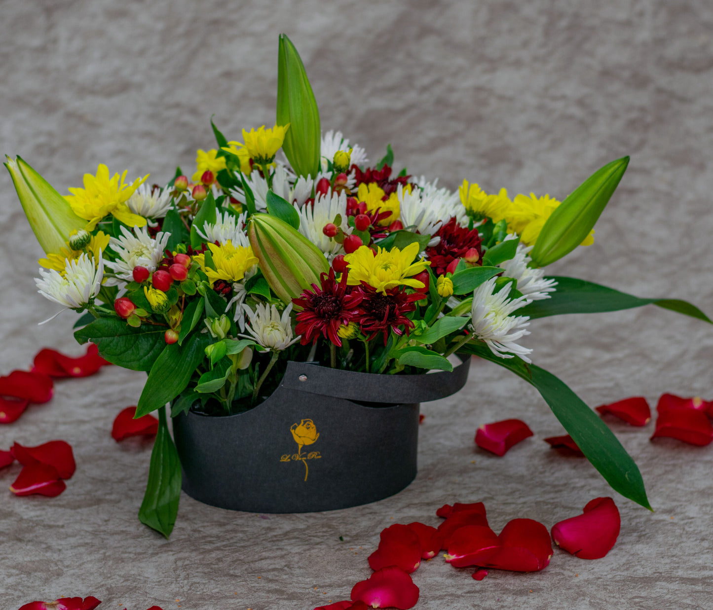 Mixed Flowers in a Black Basket