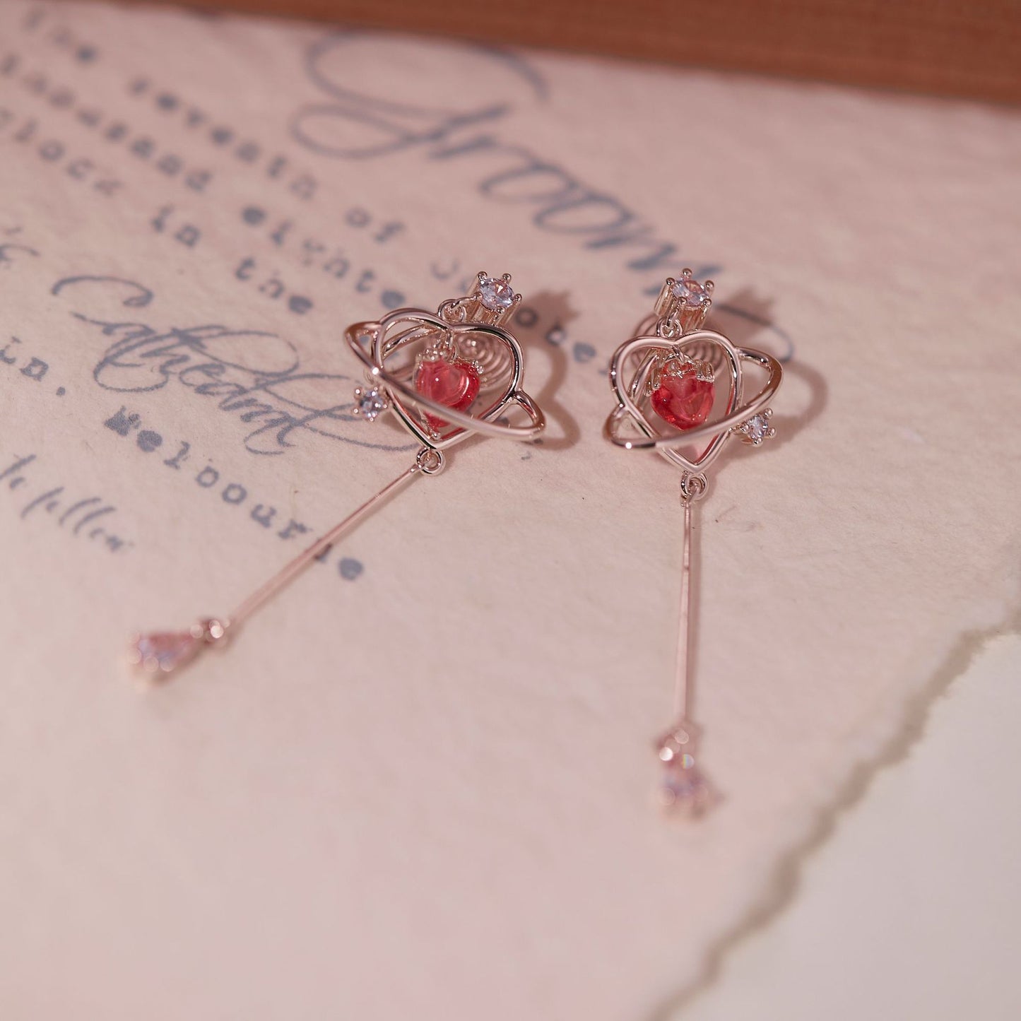 Long love-heart earrings and ear studs for women. They have a light luxury and elegant temperament.