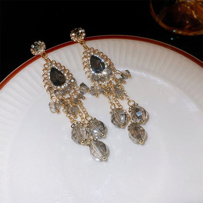Vintage high-end silver needle ethnic style diamond inlaid flower earrings with exaggerated European and American temperament earrings pendant light luxury niche earrings