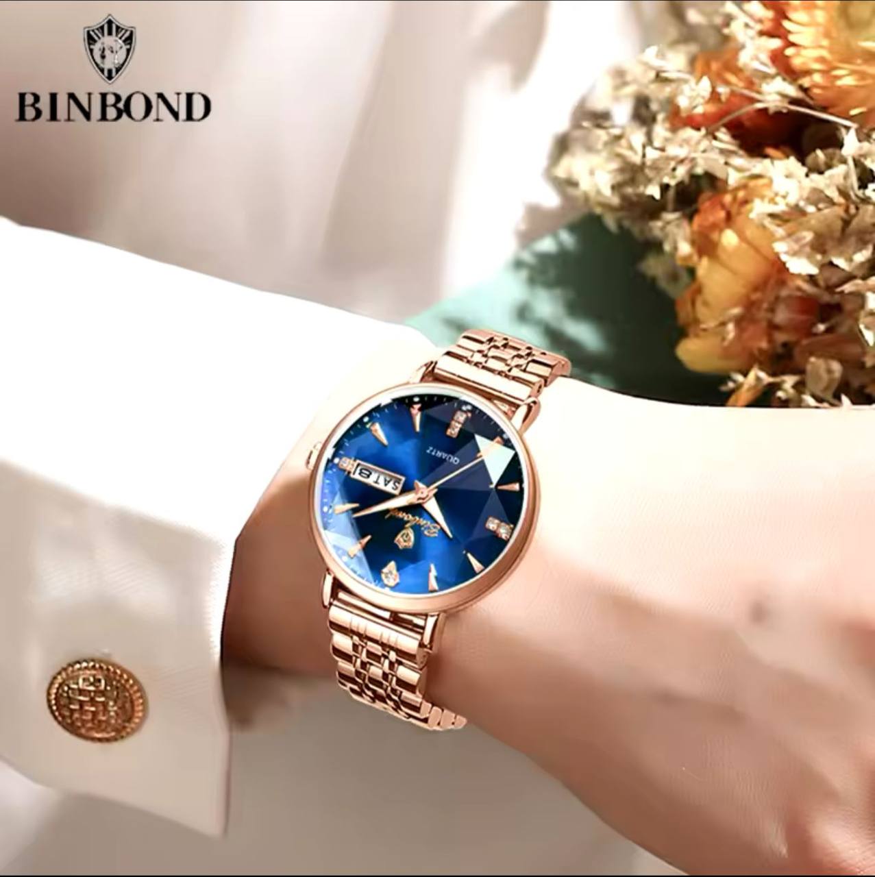 BINBOND LADIES WATER RESISTANT BATTERY POWERED NON FADE STEEL POLISH DAY AND DATE DISPLAY AND ENQUIRIES