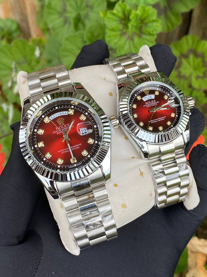 ROLEX COUPLE WATCHES SINGLE PIECE DAY AND DATE DISPLAY WATER RESISTANT BATTERY POWERED ENQUIRIES