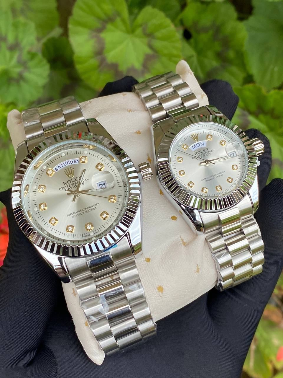 ROLEX COUPLE WATCHES SINGLE PIECE DAY AND DATE DISPLAY WATER RESISTANT BATTERY POWERED ENQUIRIES