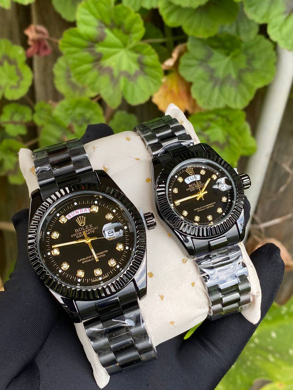 ROLEX COUPLE WATCHES SINGLE PIECE DAY AND DATE DISPLAY WATER RESISTANT BATTERY POWERED ENQUIRIES