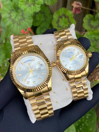 ROLEX COUPLE WATCHES SINGLE PIECE DAY AND DATE DISPLAY WATER RESISTANT BATTERY POWERED ENQUIRIES