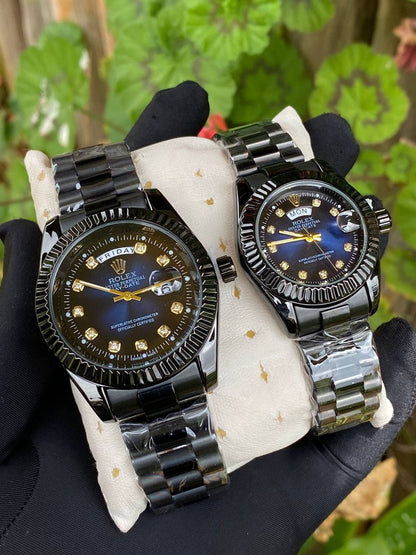 ROLEX COUPLE WATCHES SINGLE PIECE DAY AND DATE DISPLAY WATER RESISTANT BATTERY POWERED ENQUIRIES