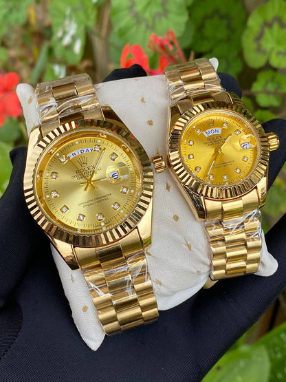 ROLEX COUPLE WATCHES SINGLE PIECE DAY AND DATE DISPLAY WATER RESISTANT BATTERY POWERED ENQUIRIES