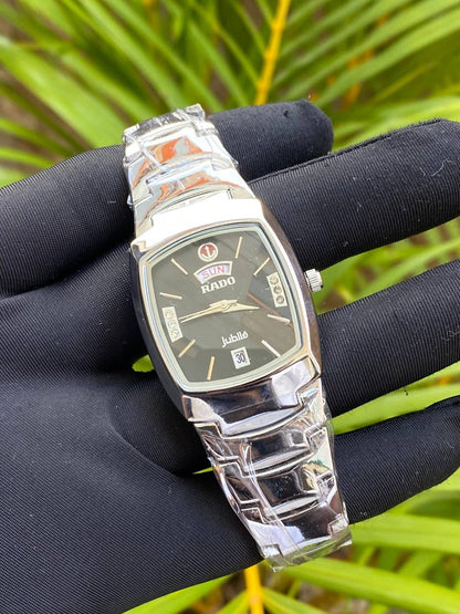 RADO GENTS WATCH DAY&DATE DISPLAY STAINLESS STEEL BATTERY POWERED WATER RESISTANT ENGRAVING SERVICES PER WORD,300 LOGO ENQUIRIES