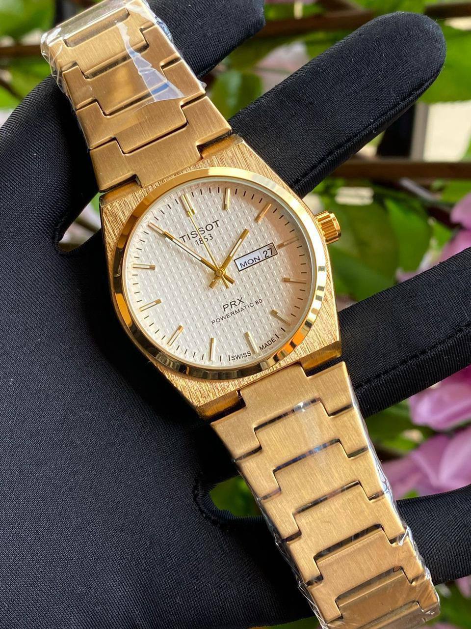 TISSOT DAY & DATE BATTERY POWERED WATER RESISTANT DAY & DATE DISPLAY STAINLESS STEEL FINISH ENGRAVING SERVICES ENQUIRIES