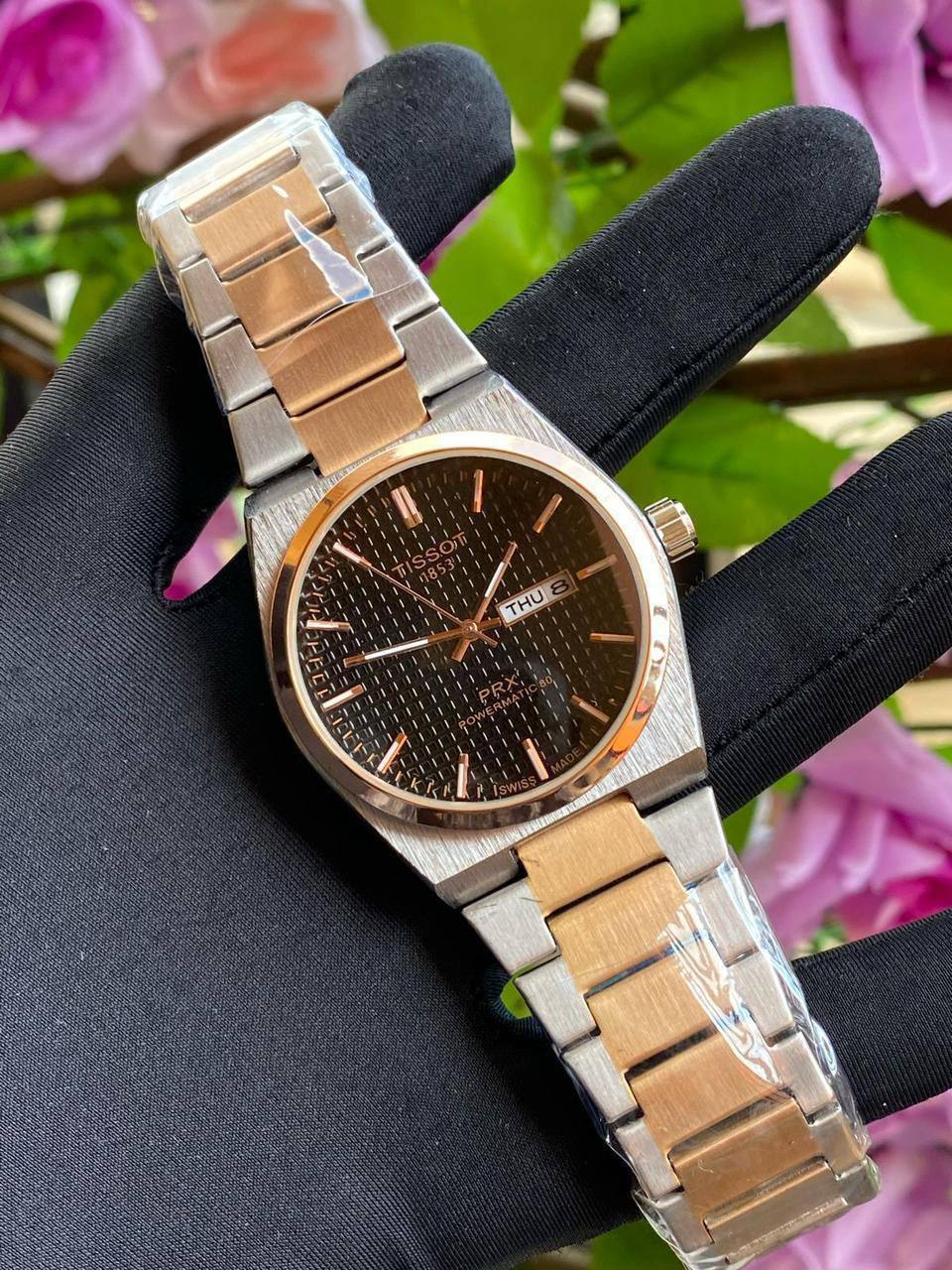 TISSOT DAY & DATE BATTERY POWERED WATER RESISTANT DAY & DATE DISPLAY STAINLESS STEEL FINISH ENGRAVING SERVICES ENQUIRIES