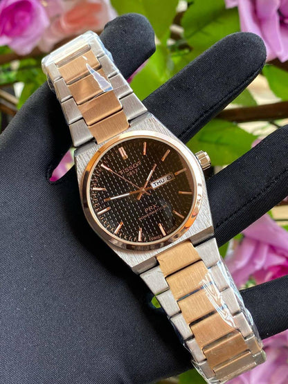 TISSOT DAY & DATE BATTERY POWERED WATER RESISTANT DAY & DATE DISPLAY STAINLESS STEEL FINISH ENGRAVING SERVICES ENQUIRIES