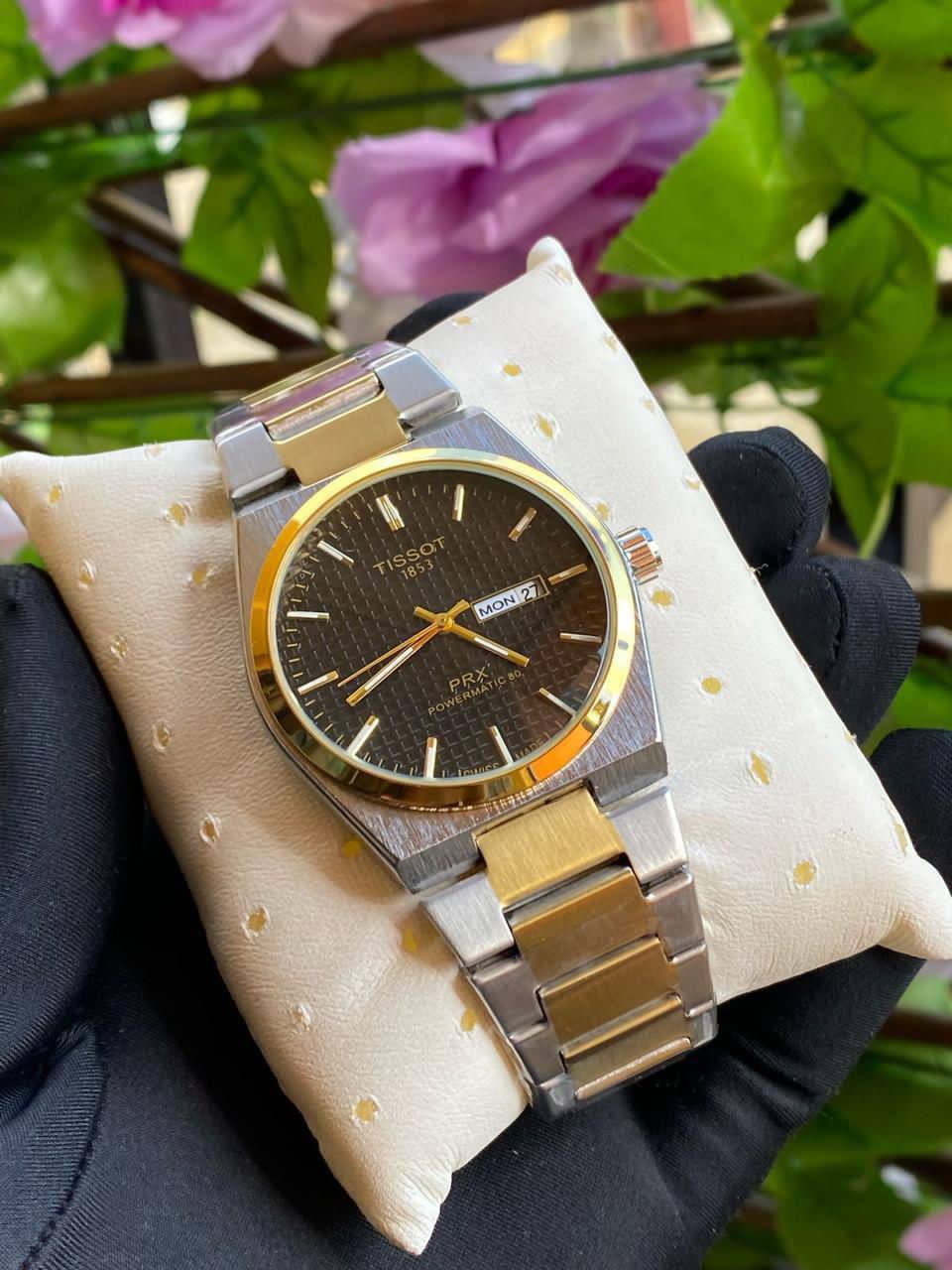 TISSOT DAY & DATE BATTERY POWERED WATER RESISTANT DAY & DATE DISPLAY STAINLESS STEEL FINISH ENGRAVING SERVICES ENQUIRIES