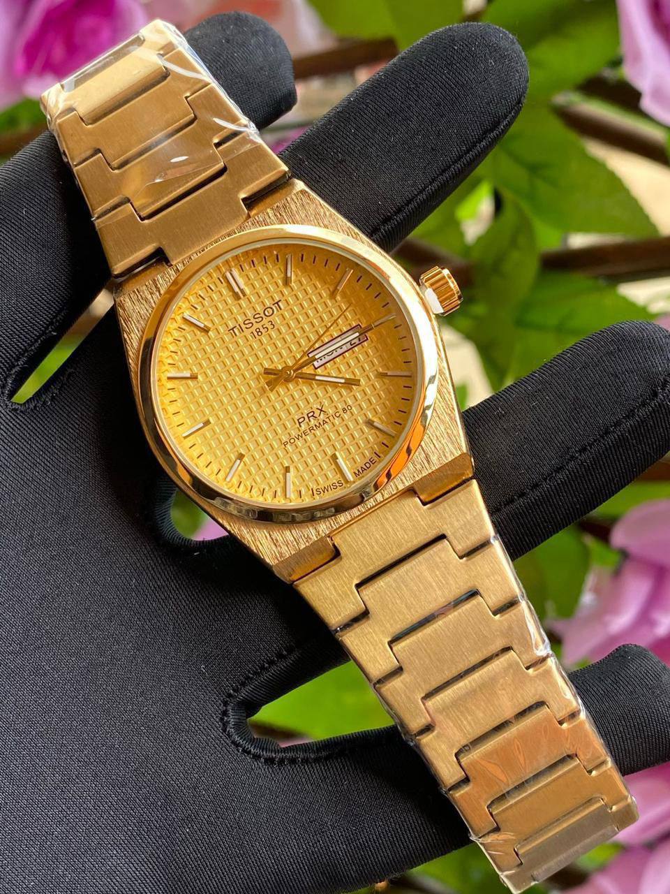 TISSOT DAY & DATE BATTERY POWERED WATER RESISTANT DAY & DATE DISPLAY STAINLESS STEEL FINISH ENGRAVING SERVICES ENQUIRIES