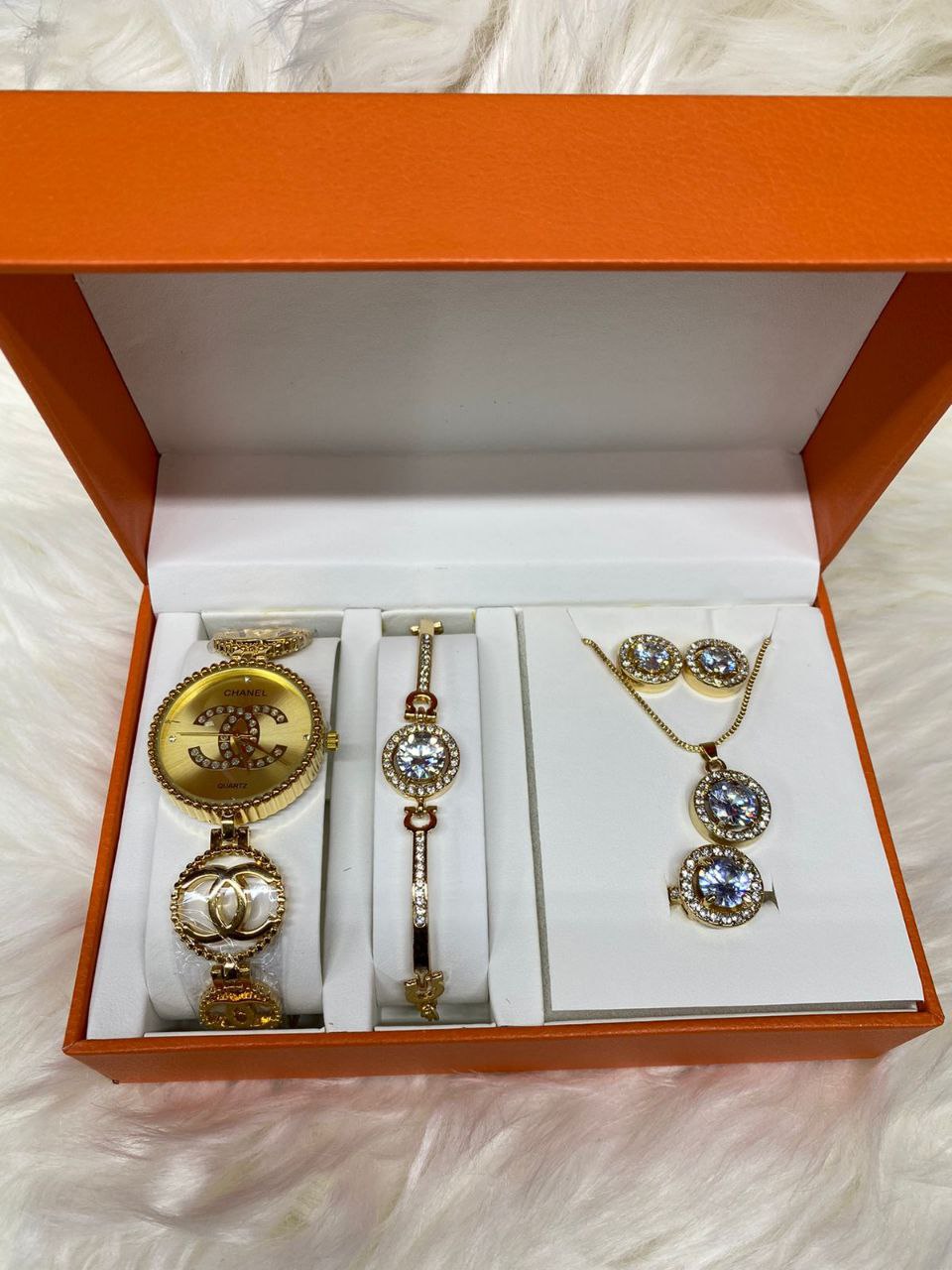 A SET OF WATCH BRACELET NECKLACE EARRINGS RING