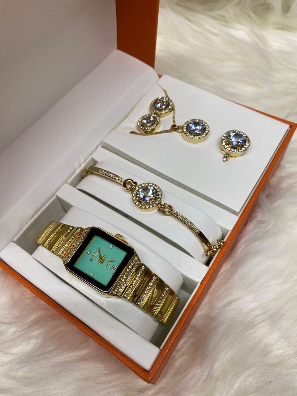 A SET OF WATCH BRACELET NECKLACE EARRINGS RING