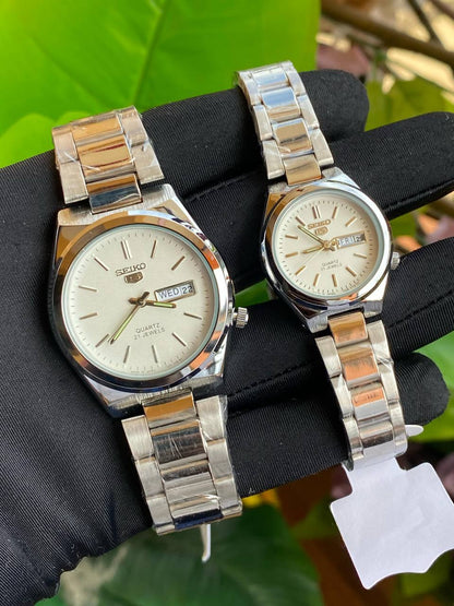 SEIKO 5 COUPLE WATCHES SINGLE PIECE DAY&DATE DISPLAY WATER RESISTANT BATTERY POWERED STAINLESS STEEL COUPLE BOXES ENQUIRIES