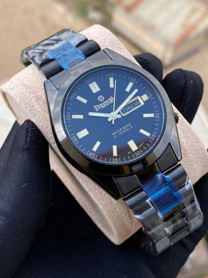 SVESTON GENTS WATCH DAY AND DATE DISPLAY(ARABIC &ENGLISH) ILLUMINATING FACE 3ATM WATER RESISTANT BATTERY POWERED