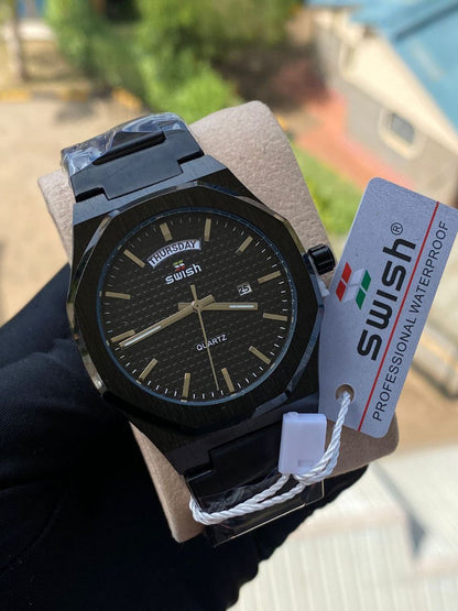SWISH GENTS WATCH DAY&DATE DISPLAY BATTERY POWERED STAINLESS STEEL WATER RESISTANT TWO-TONE GOLDBLACK ENQUIRIES