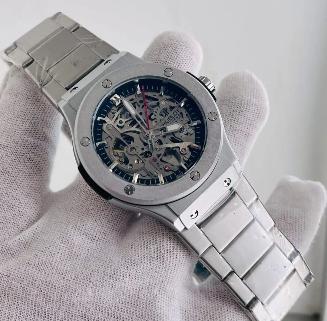HUBLOT AUTOMATIC METALLIC STRAP STAINLESS STEEL WATER RESISTANT AUTOMATIC MOVEMENT HUBLOT BRANDED BOX ENQUIRIES