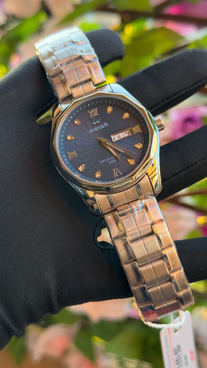 SWISH GENTS WATCH DAY&DATE DISPLAY BATTERY POWERED STAINLESS STEEL WATER RESISTANT TWO-TONE GOLDSILVER