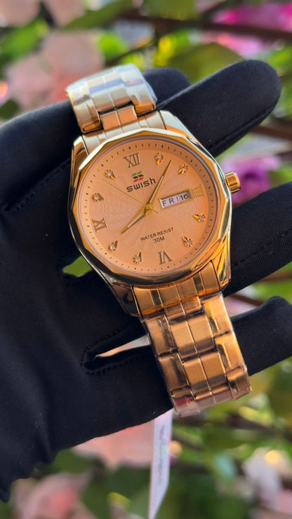 SWISH GENTS WATCH DAY&DATE DISPLAY BATTERY POWERED STAINLESS STEEL WATER RESISTANT TWO-TONE GOLDSILVER