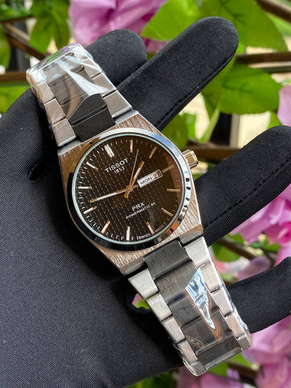 TISSOT DAY & DATE BATTERY POWERED WATER RESISTANT DAY & DATE DISPLAY STAINLESS STEEL FINISH ENQUIRIES