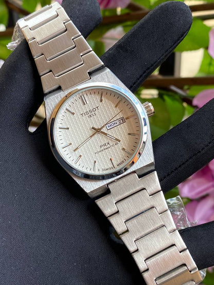 TISSOT DAY & DATE BATTERY POWERED WATER RESISTANT DAY & DATE DISPLAY STAINLESS STEEL FINISH ENQUIRIES