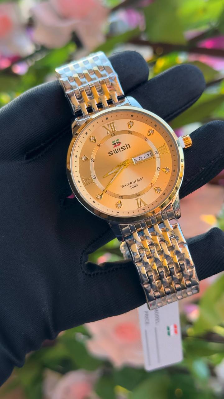 SWISH GENTS WATCH DAY&DATE DISPLAY BATTERY POWERED STAINLESS STEEL WATER RESISTANT TWO-TONE GOLD ENQUIRIES