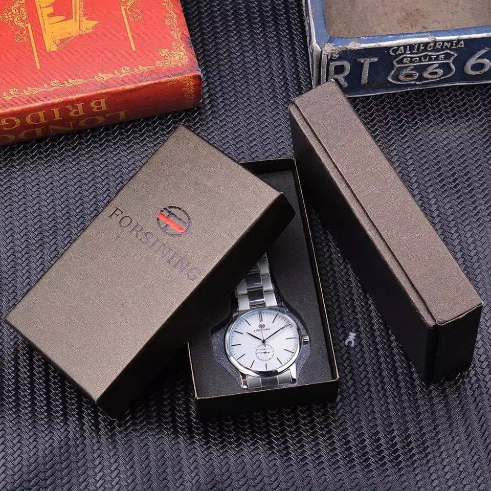 FORSINING AUTOMATIC GENTS WATCH AUTOMATIC MOVEMENT WATER RESISTANT STAINLESS STEEL COMES A BRANDED GIFT BOX ENQUIRIES