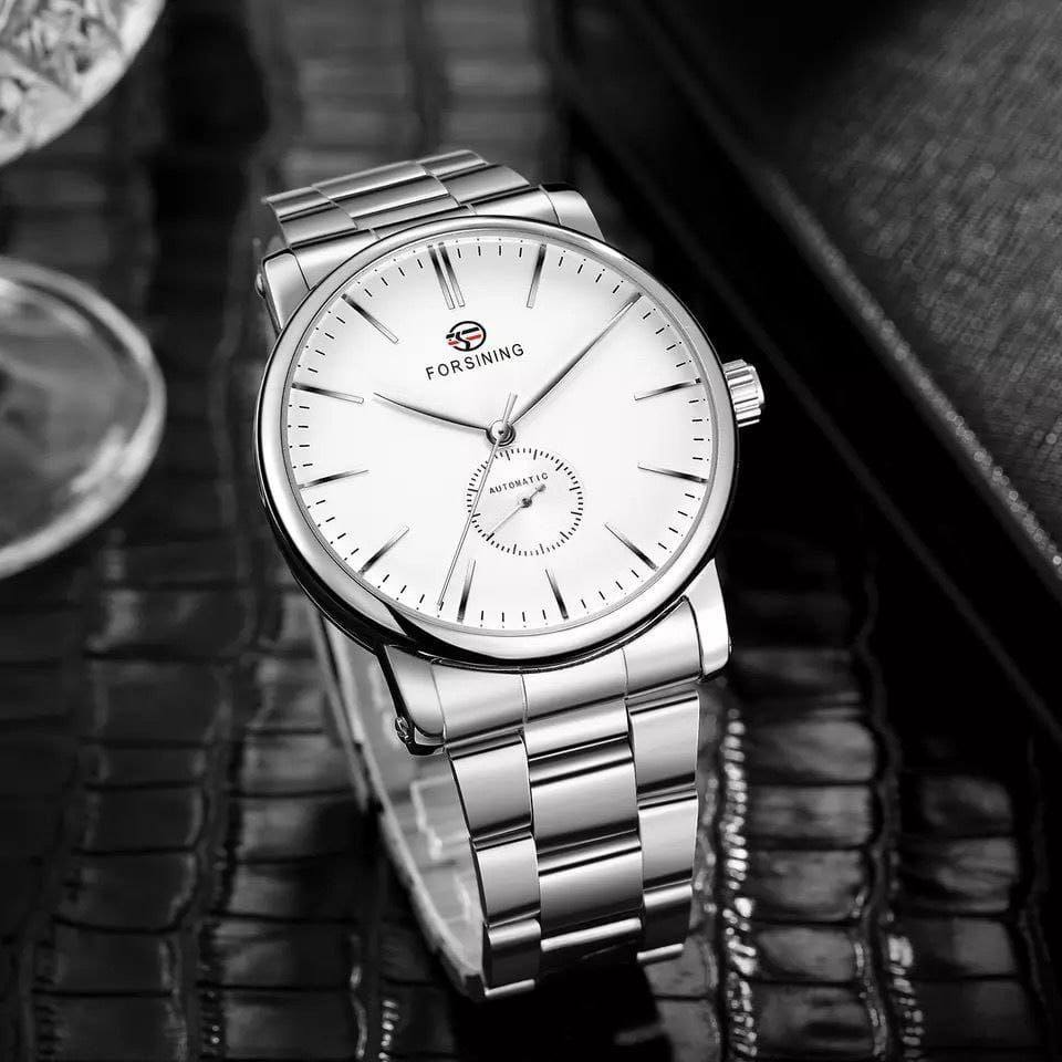 FORSINING AUTOMATIC GENTS WATCH AUTOMATIC MOVEMENT WATER RESISTANT STAINLESS STEEL COMES A BRANDED GIFT BOX ENQUIRIES