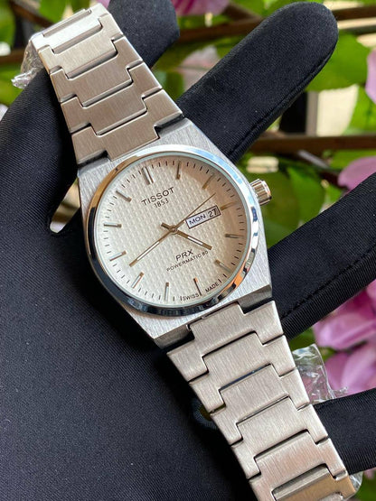 TISSOT DAY & DATE BATTERY POWERED WATER RESISTANT DAY & DATE DISPLAY STAINLESS STEEL FINISH ENQUIRIES